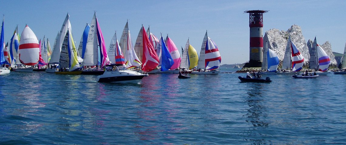 Sailboats with colorful sails on the water – ideal surfaces for Monstercolors™ Flexithane Marine Paint, flexible and weatherproof coating