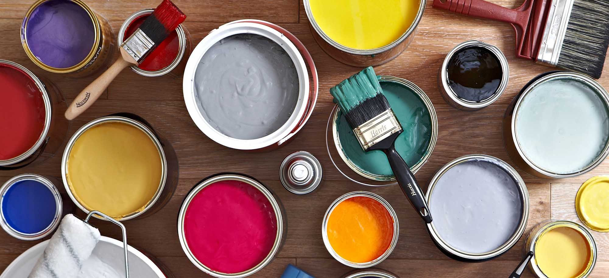 Open paint tins in various colours with brushes – Monstercolors™ Thinner & Prep Cleaner for pro paint prep and cleaning