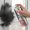 Person using a spray paint can to touch up a pvc window.